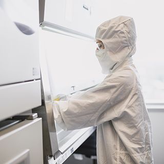 Gowned operator in the Spark Therapeutics gene therapy manufacturing facilities